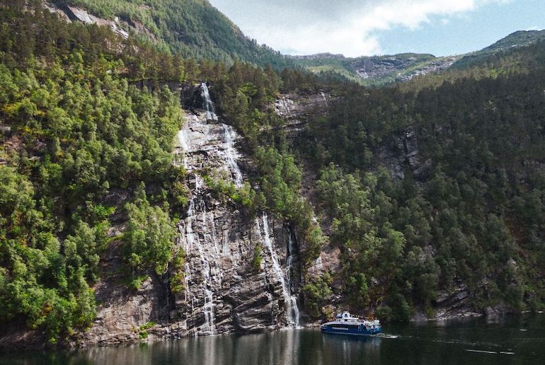 On a cruise from Bergen to Mostraumen, you'll see waterfalls and dramatic scenery