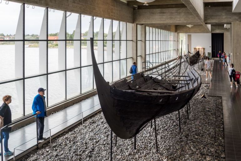 See renovated Viking longships in a museum in Roskilde, Denamrk